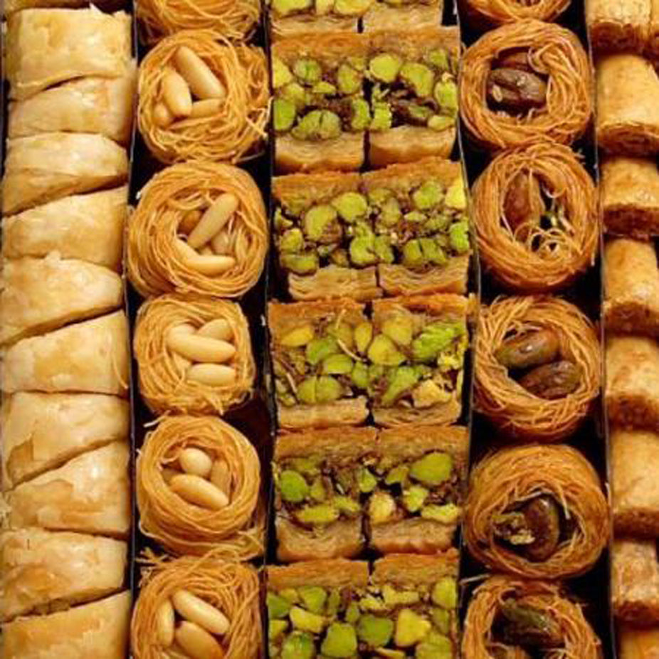 A variety of Middle Eastern Arabic Premium Assorted Baklava made from fine sheets or shredded phyllo dough, layered with handpicked quality ingredients, then baked using purified butter, and soaked in our special sugar syrup. Sugar-free baklava available